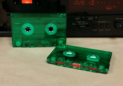 green transparent cassette with red leaders
